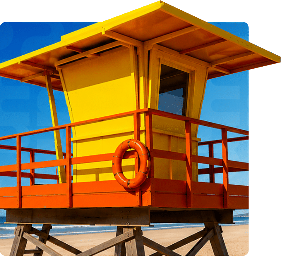 Yellow and orange lifeguard tower with a lifebuoy on a sunny beach